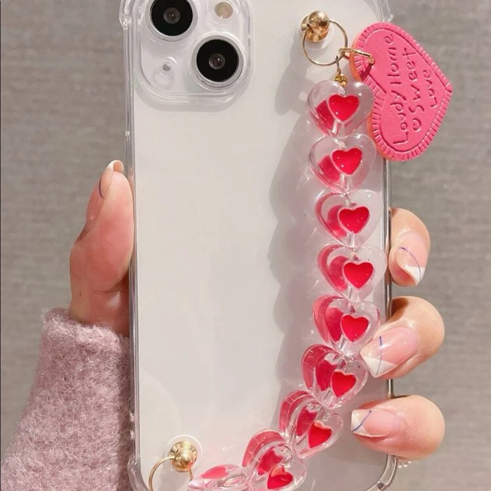 Clear iPhone XS case with heart hand strap